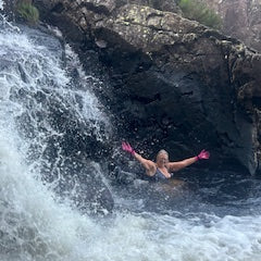 happy lady in a waterfall