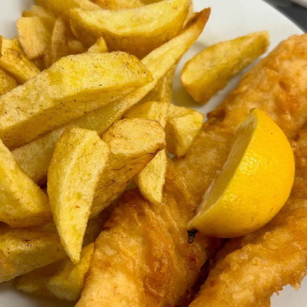 Fish and chips on a white plate